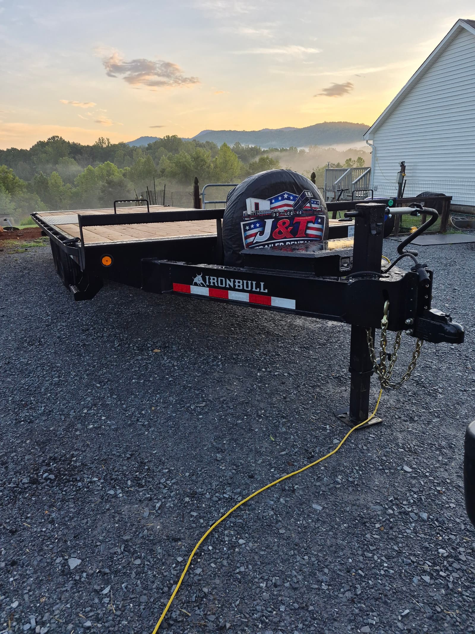 Deck Over Tilt Trailer for rent - 2027 Iron Bull 22ft full deck over tilt with no wheel wells — ideal for wide equipment and vehicles.